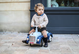 toddler with ride on toy car